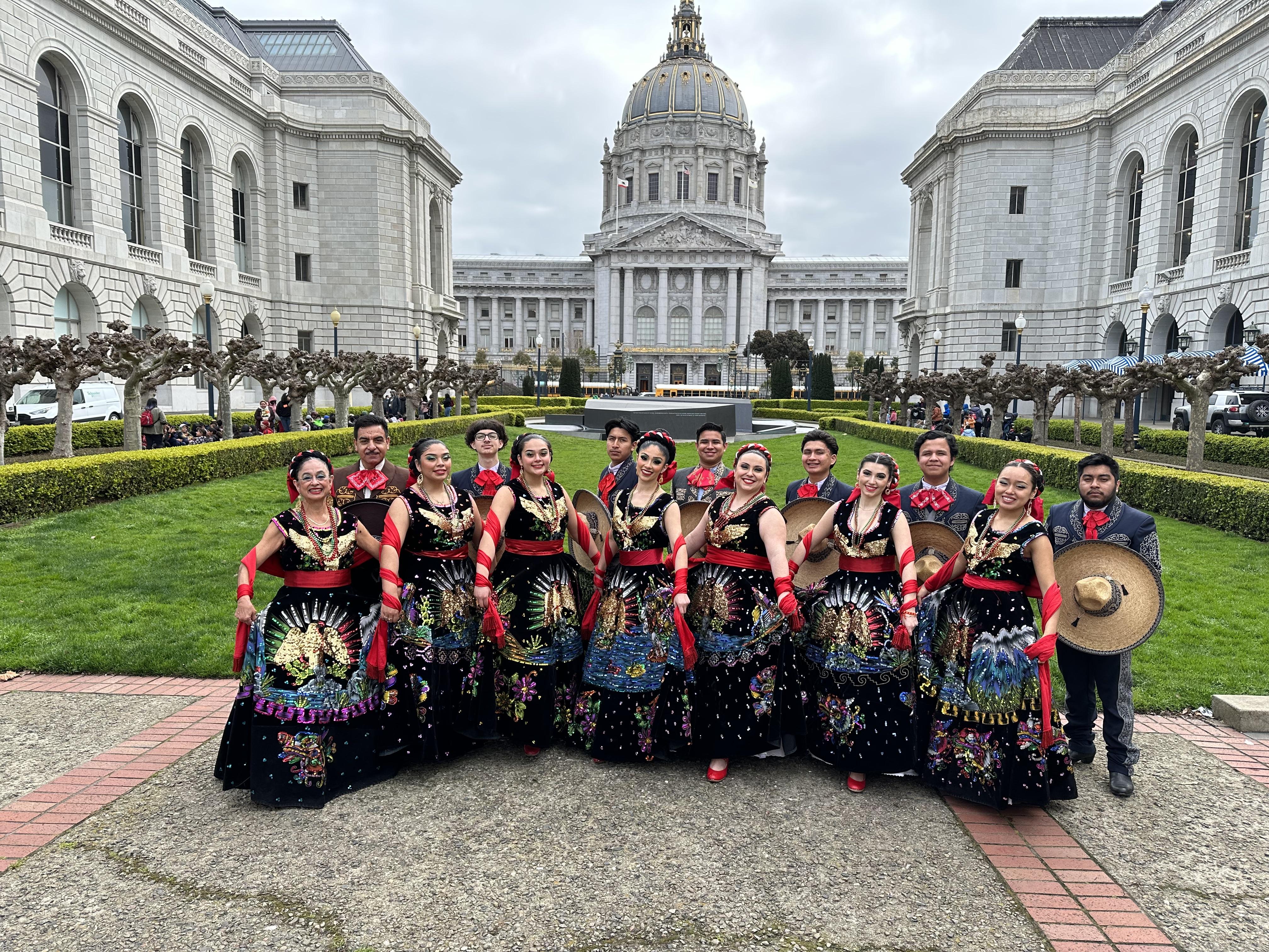 Students of South San Francisco High School's Ballet Folklórico Alma de México program pose in front of San Francisco City Hall on March 20, 2023, before performing at the War Memorial Opera House as part of San Francisco Unified School District's annual Children's Day celebration.
