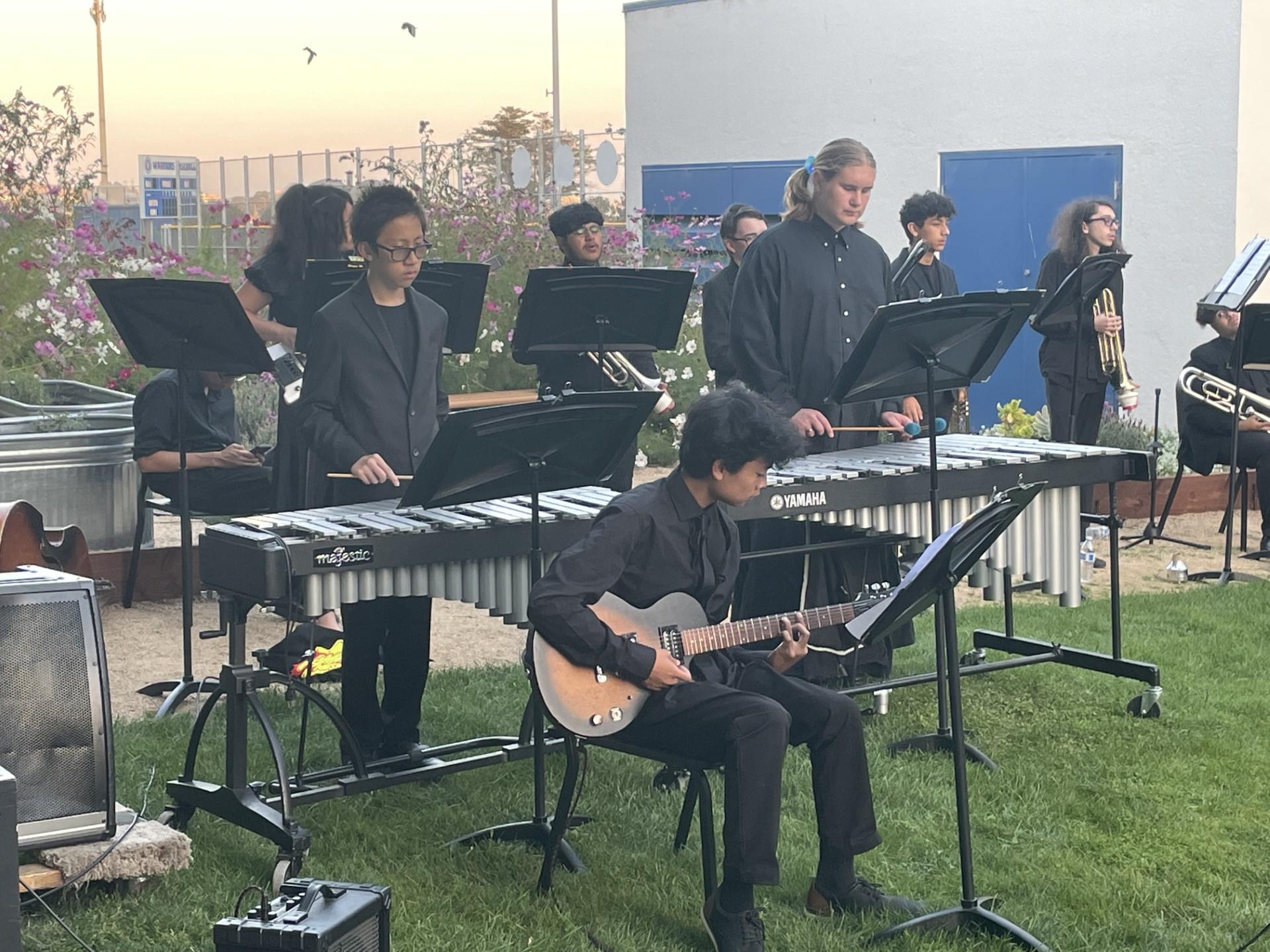 Members of the South City High jazz band perform at the Earth Club's 2023 Dinner in the Dark fundraiser.