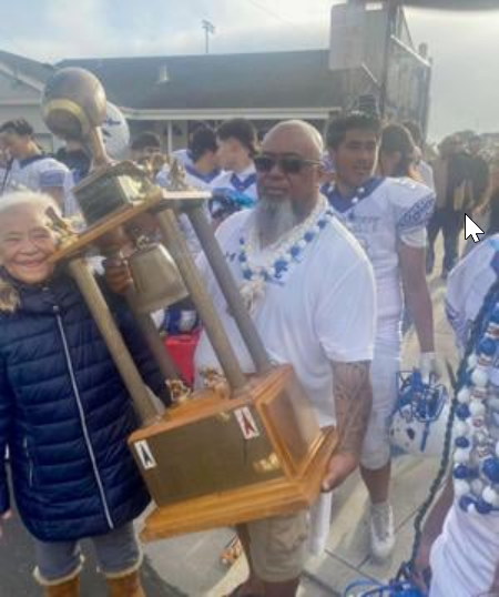 South City head coach Kolone Pua with the Bell Trophy after the Warriors’ 36-0 win Saturday at El Camino.  (Source: Kolone Pua(