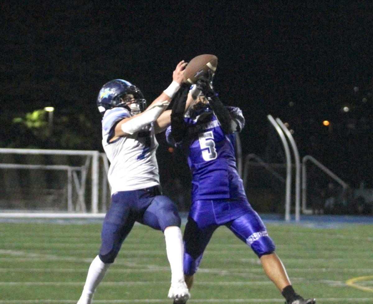 South City defensive back Cisco Lutu (r) breaks up a pass in the second quarter of the Warriors’ 11-9 CCS Division V semifinal win over Leland. (Source: Nathan Mollat, San Mateo Daily Journal)